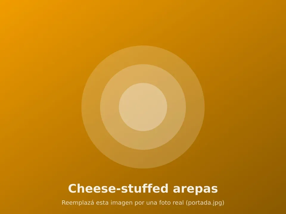 Golden arepas split open with melted cheese